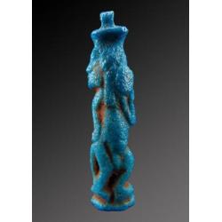 Egyptian faience amulet of Bes, dancing and playing the tamb