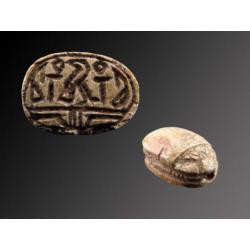 Egyptian steatite scarab with decorations of Horus with the