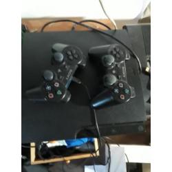 Ps3 met 11 spellen en 2 controllers